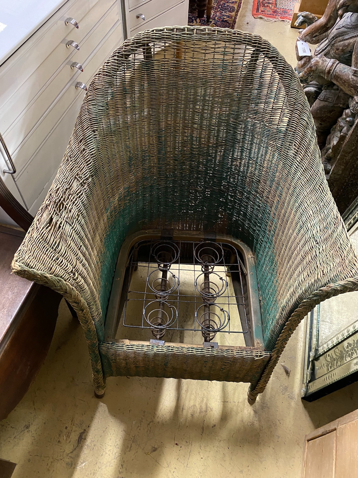 A green painted Lloyd Loom armchair and a Regency mahogany commode chair